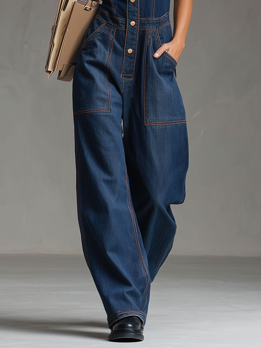 The Vintage Denim Jumpsuit by Mila and June — dark blue denim with multi-pocket utility styling and decorative topstitching