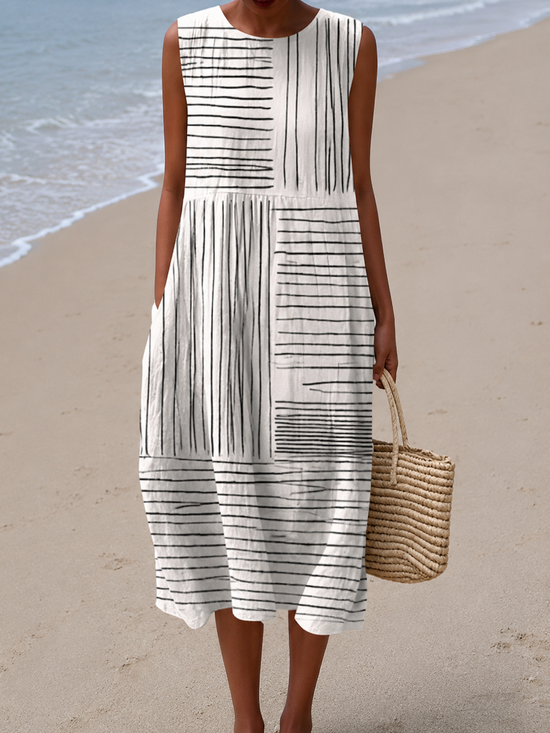 The Amara sleeveless midi dress by Mila and June with hand-drawn black graphic print on crisp white